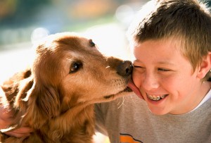 getty_rf_photo_of_dog_licking_boy_on_cheek